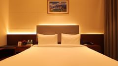 view of the king size bed of Suite at Pride Elite, Haridwar