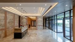 An image showcasing the reception area featuring a reception desk and tiled floors - Sarovar Portico, Ajmer