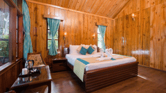 bedroom with wooden interiors in Lagoon Suite 6