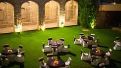 Lawn with beautifully arranged table and chairs