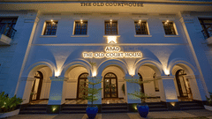 facade image at late evening of the old court house by abad, fort kochi