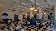 Best Restaurant in Fort Kochi - elegant dining hall with checkered floor and colonial-style interiors at The Old Court House.