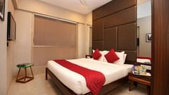 well-furnished room with cosy bed in khar