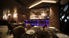 Seating arrangements inside the bar & restaurant with modern interiors - VITS Bharat Nanded