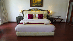 a double bed inside Queen Suite - White pearl suites by rosetum 