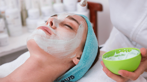 A relaxing facial treatment being applied by a professional therapist