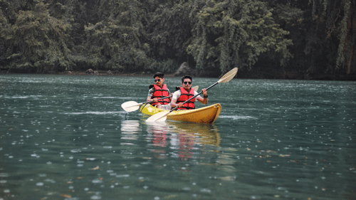 two people kayaking near havelock island wearing safety vests