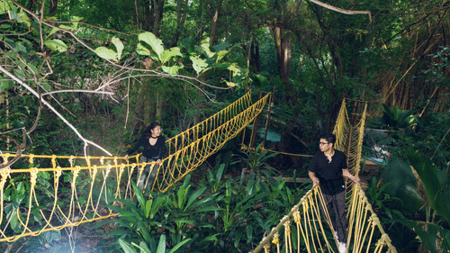 Two people walking in two Burma Bridges in the night - Black Thunder, Coimbatore