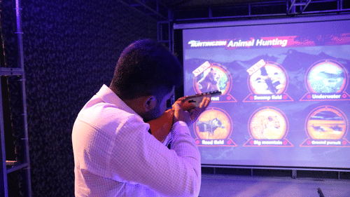 A person shooting at the screen inside Hunting Club - Black Thunder, Coimbatore
