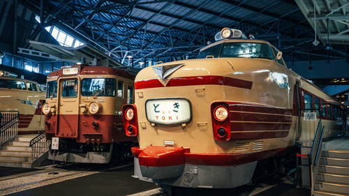 An overview of a railway museum with two trains placed inside as exhibits.