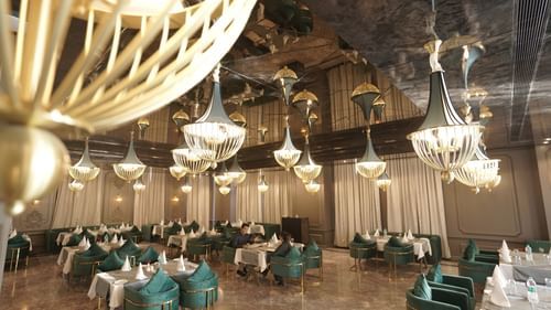 restaurant seating area with tables and chairs at Classic Sapphire by Ananta