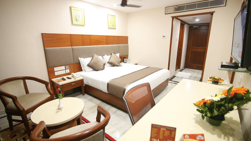 King-sized bed at Hotel Daspalla Executive Court Vishakapatnam 1