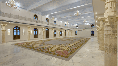 Fateh Vilas Udaipur - Interior view of the Surya Prakash hall with white decor and chandeliers