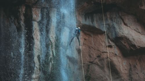 Rapelling down a cliff