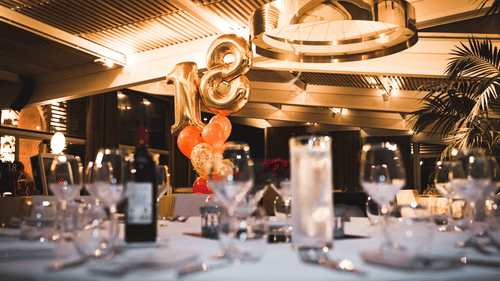 A banquet hall decorated for an 18th birthday party