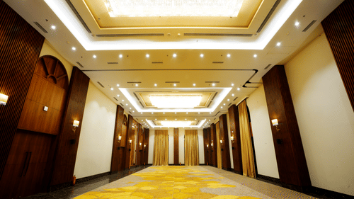 An image of an empty yet well-lit banquet hall  - Polo Hotel Agartala