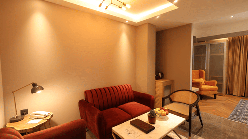 Elegant living room with red sofa