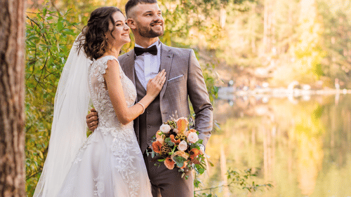 a couple smiling for a wedding shoot