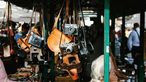 A camera market with a focus on a shop having different types of cameras kept to be sold at Dharamtala Market Kolkata