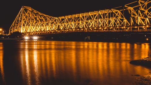 The view of Howrah bridge in the night with lights on 