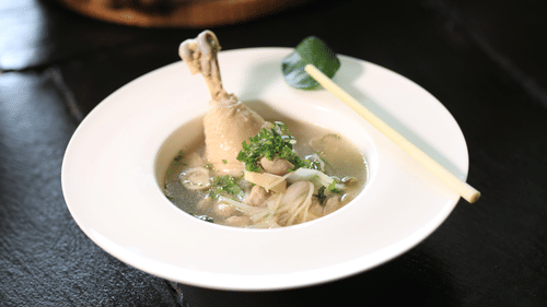 image of a white plate featuring Chicken stew