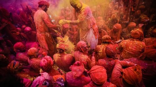 image of a people gathered in huge crowds playing with colours