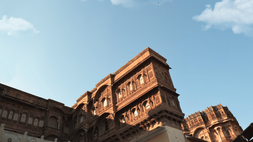 A view rom below of Bala Quila with blue sky in the background.