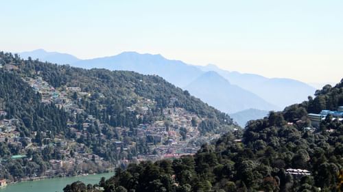 View from Naini Peak with a lake flowing between the mountains