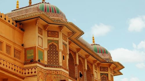 intricate murals on the wall of Rajasthani fort
