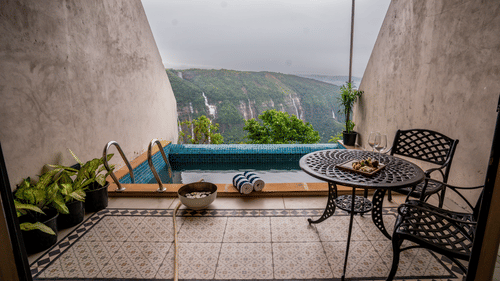 Private balcony with scenic valley views and cosy seating arrangement - Polo Cherrapunjee Resort