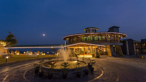 Night view of a modern resort with fountain