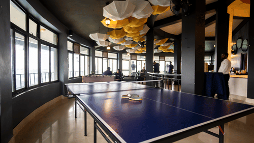 A table tennis set up in a room - Polo Cherrapunjee Resort