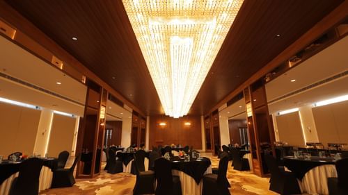 view of the banquet hall with chairs and tables at Pride Elite, Haridwar