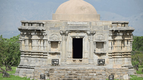 facade image of an Old Temple in Chennai made of stones with blue sky in the background