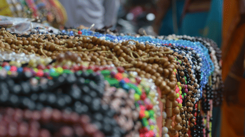 A pile of beads in different colors on a table
