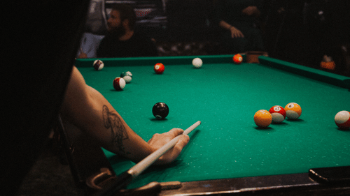 stock image where a person plays billiard