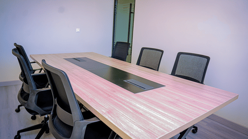 A boardroom in Hargeisa featuring a sleek wooden table and ergonomic chairs - Serene Sarovar Premiere Hargeisa