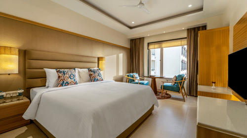 An overview of the Deluxe double room at Shyama Sarovar Portico Orai