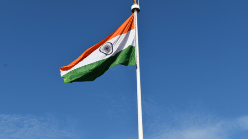 Indian flag hoisted with a background of clear blue skies