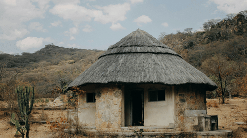 A wide view of a hut in a  deserted place. 