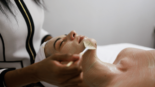 A woman receiving spa service at The Soco House.