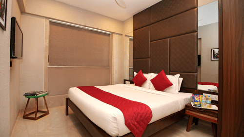 well-furnished room with cosy bed in khar