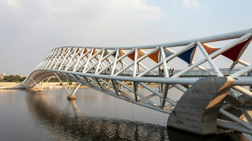 Side wide view of Atal pedestrian bridge with its modern and colourful architecture on Ganges river.
