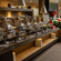 Buffet counter at The Courtyard Restaurant, Featherlite Evoma Hotel with chafing dishes, fresh produce and warm ambient lighting nearby.