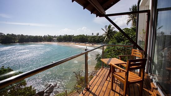 outside view of the sea view superior suite with a beautiful view of the ocean at a bright afternoon at the beacon by the bay villas and suites