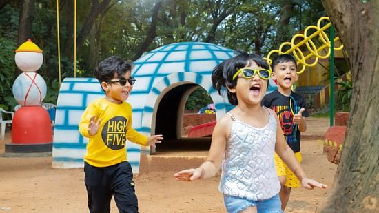 Children joyfully running and playing outdoors at Black Thunder Water Theme Park