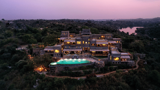 An aerial view from a drone of Chunda Shikar Oudi with the swimming pool in full view. 