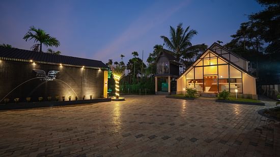Night view of property with open space with tress in the background at Feel Free Retreat, Wayanad