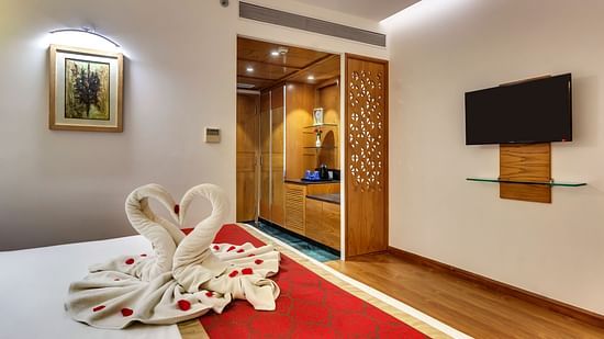 swan towel art on a bed at Golden Tulip New Delhi, Hari Nagar