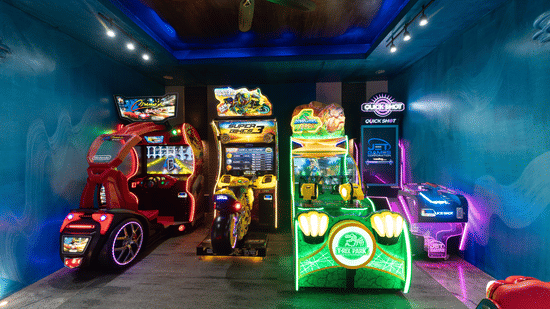 Vibrant gaming arcade room featuring interactive video arcade machines at Kenilworth Resort & Spa, Goa.